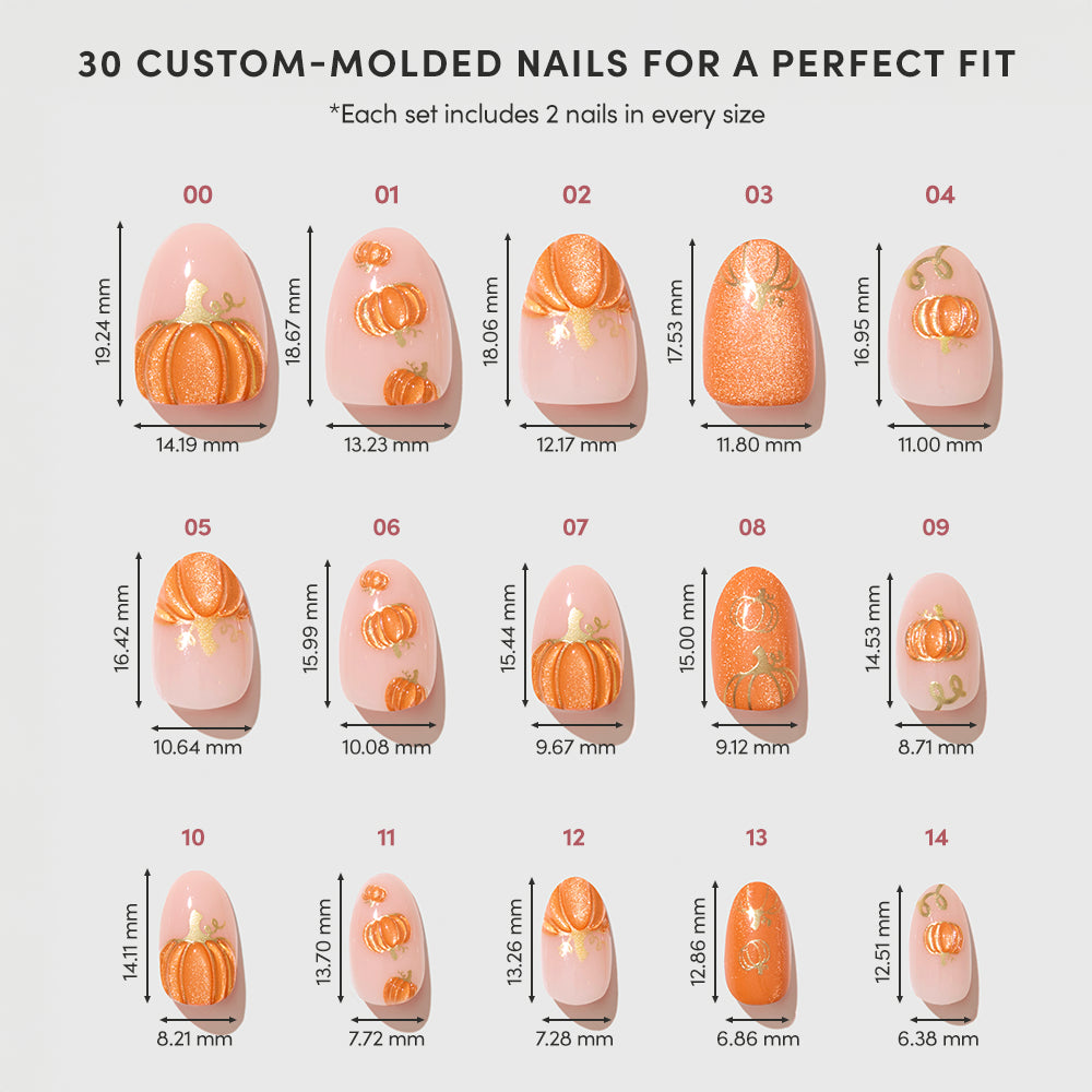 A set of 15 “Golden Gourds” pumpkin-themed custom-molded press-on nails by glamnetic, offered in various sizes with each nail labeled in millimeters for length and width, displayed on a white background. - Product image