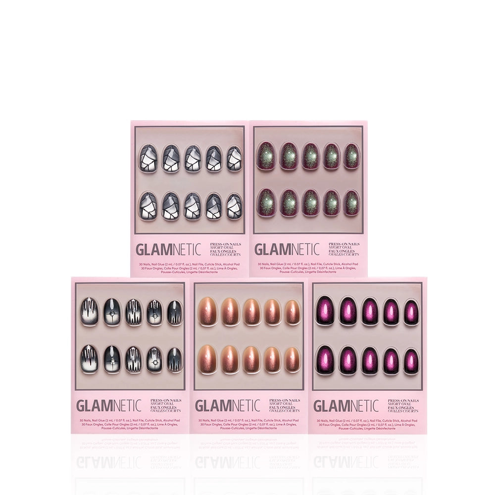 Five boxes of Hexed Ovals press-on nails from glamnetic, each featuring unique designs: geometric silver, green glitter, black and white artistic lines, copper shimmer, and purple cat-eye. This striking nail art bundle showcases every style on a white background with a reflective finish. - Product image