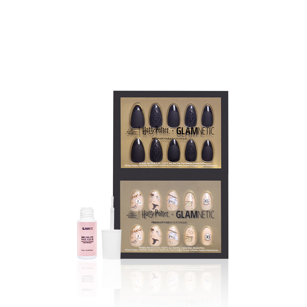 Get two sets of black and cream Hogwarts™ Spirit press-on nails from glamnetic, inspired by Harry Potter, plus a small bottle of vegan, cruelty-free nail glue with applicator brush. Nails come in stylish gold packaging. - Product image