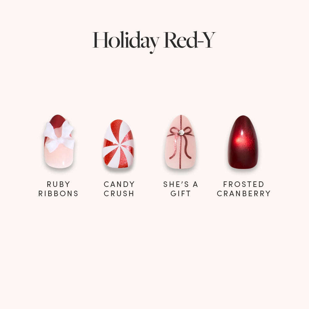 Glamnetic’s Holiday Red-y nail set features festive red and pink designs—Ruby Ribbons, Candy Crush, She’s a Gift, and Frosted Cranberry—displayed on a light background for a holiday-ready look.