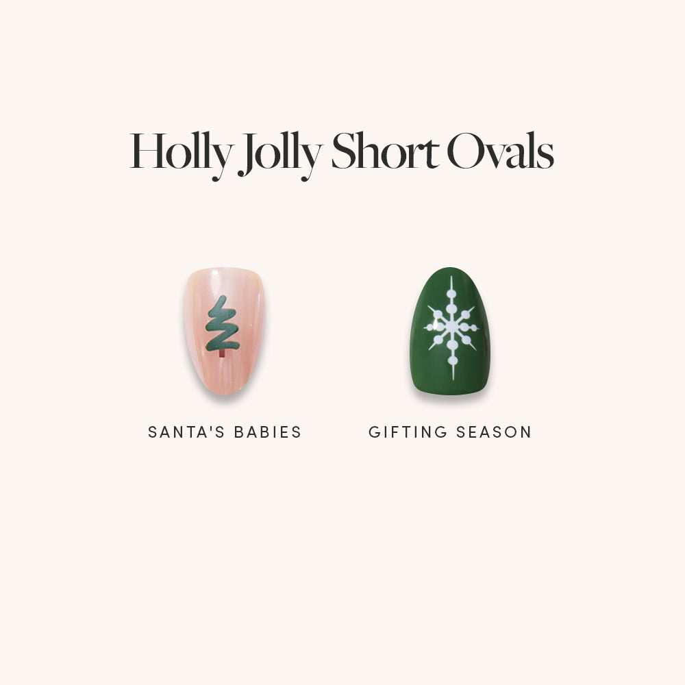 Holly Jolly Short Ovals press-on nails: one light pink with a dark green tree design labeled Santas Babies, and one dark green with a white snowflake design labeled Gifting Season.
