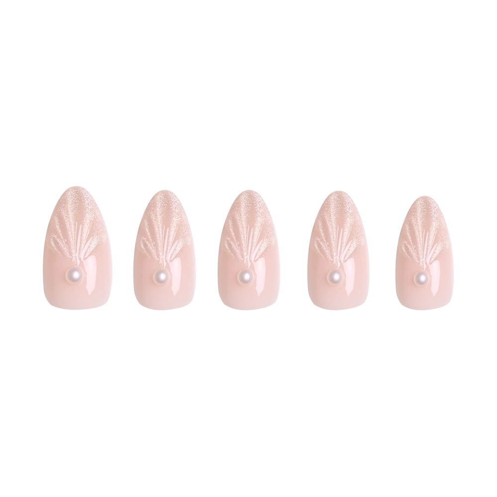 Five pale pink artificial nails from glamnetic’s Honeymoon set feature shimmery fan designs near the cuticle and delicate pearl accents, creating a romantic look. - Product image