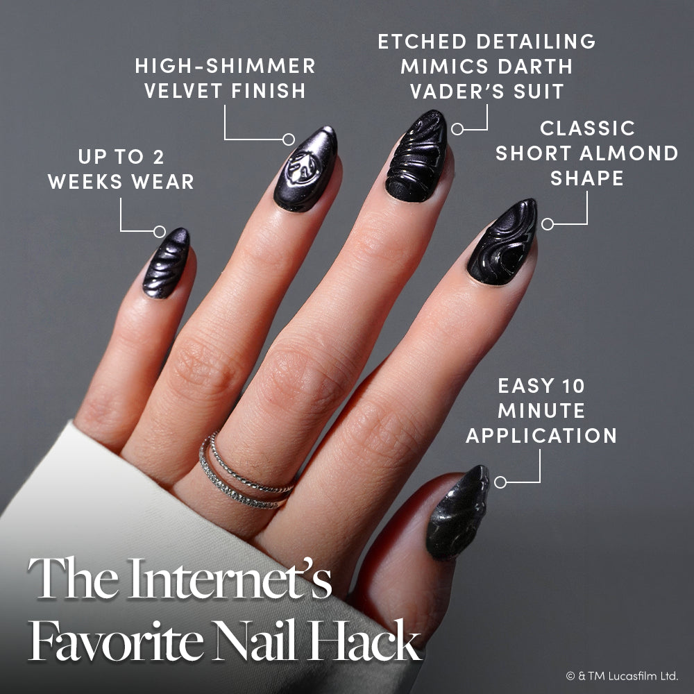 I Am Your Father - A hand showcases almond-shaped black nails with etched Darth Vader-inspired designs. Labels highlight a shimmer velvet finish, easy 10-minute application, and up to 2 weeks of wear. Text reads: The Internet’s Favorite Nail Hack. Perfect for STAR WARS press-on nail fans, the “I Am Your Father” set by glamnetic delivers the ultimate Darth Vader look in a luxe velvet finish press-on style.
