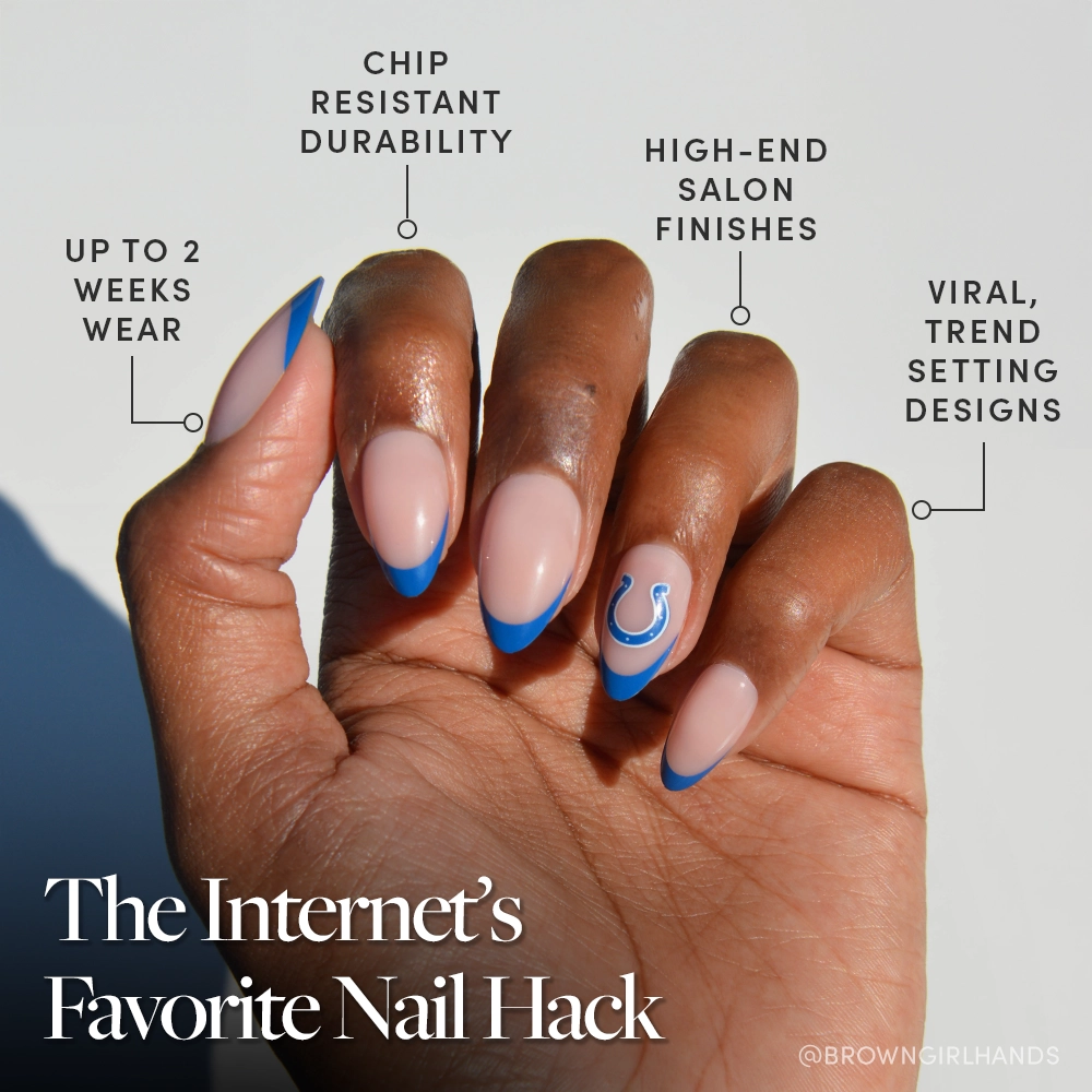 The glamnetic Indianapolis Colts Press-On Nail Set features almond-shaped nude nails with bright blue French tips and a blue horseshoe, offering chip resistance, long wear, salon-quality finish, and trendy style for fans. - Product image