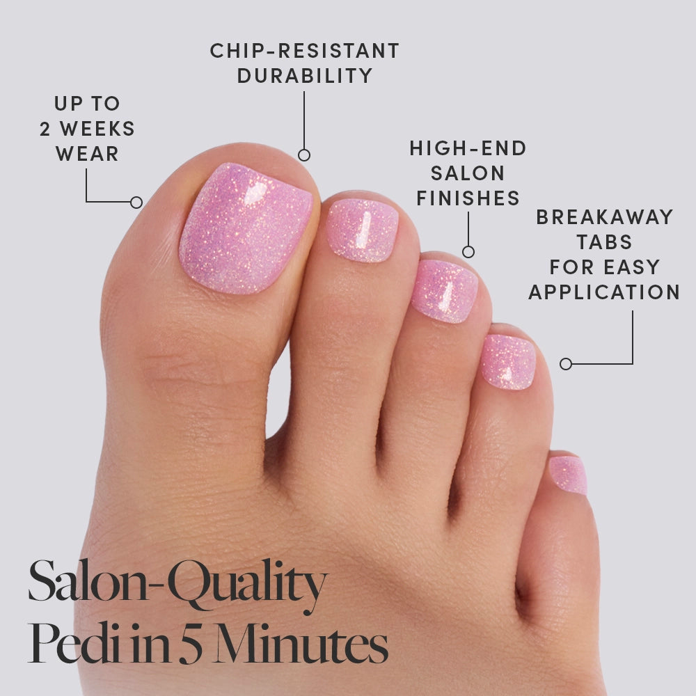 A close-up of toes with pink glittery nail polish showcases glamnetic Juicy Toenail press-ons—chip-resistant, last up to 2 weeks, offer salon-quality shine, and have breakaway tabs. Text: Salon-Quality Pedi in 5 Minutes. - Product image
