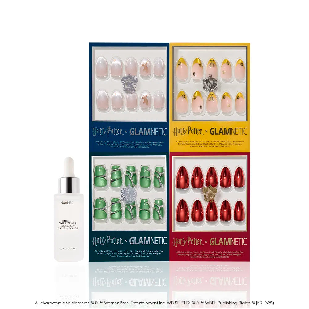 Four Legacy Legends nail sets by glamnetic—in blue, yellow, green, and red boxes with unique house-inspired designs—are displayed beside a white “glamnetic Cuticle Oil” dropper bottle. - Product image