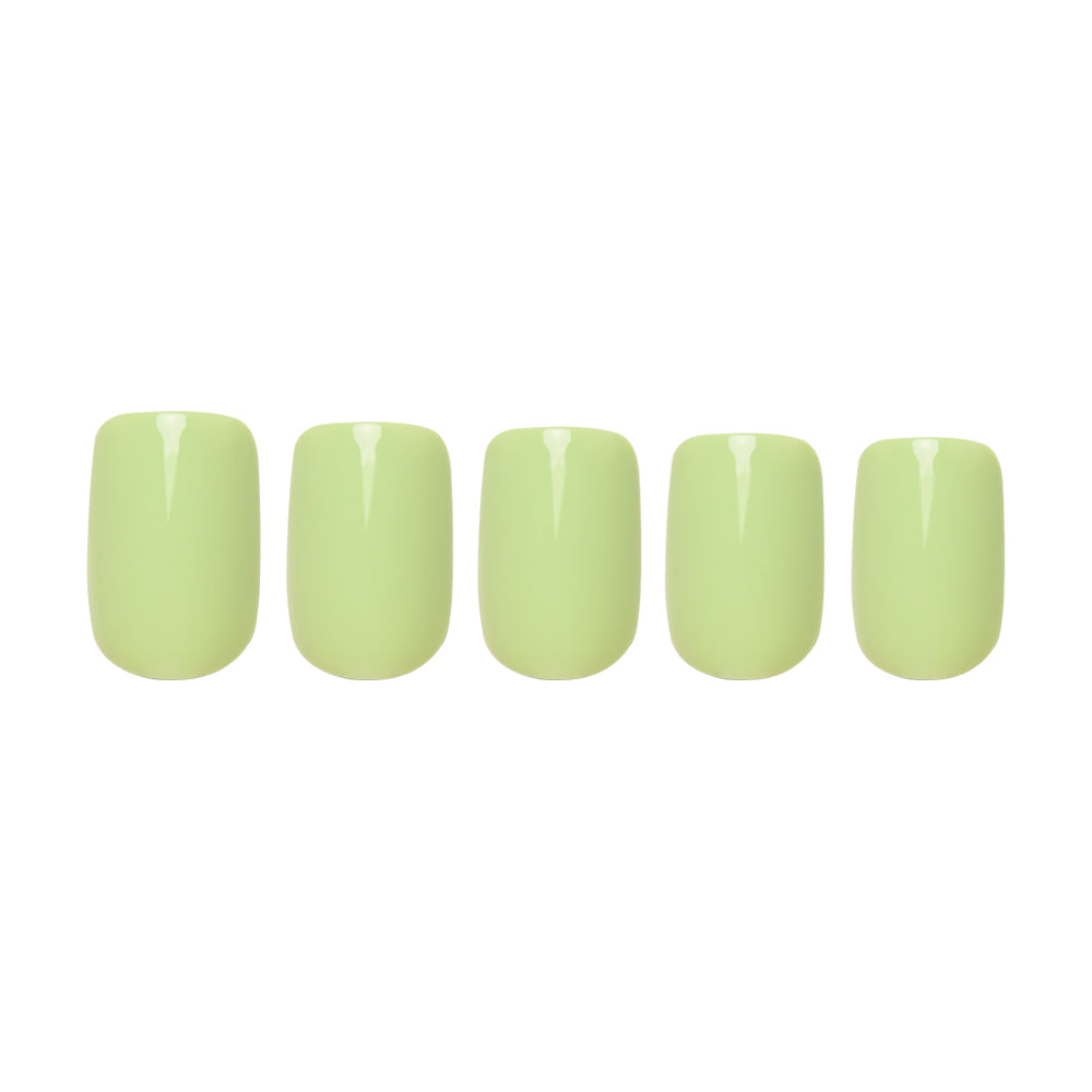 Five glossy pastel light green squoval nails from glamnetic’s Light Sage set are arranged in a row on a white background, highlighting their elegant, flawless finish. - Product image