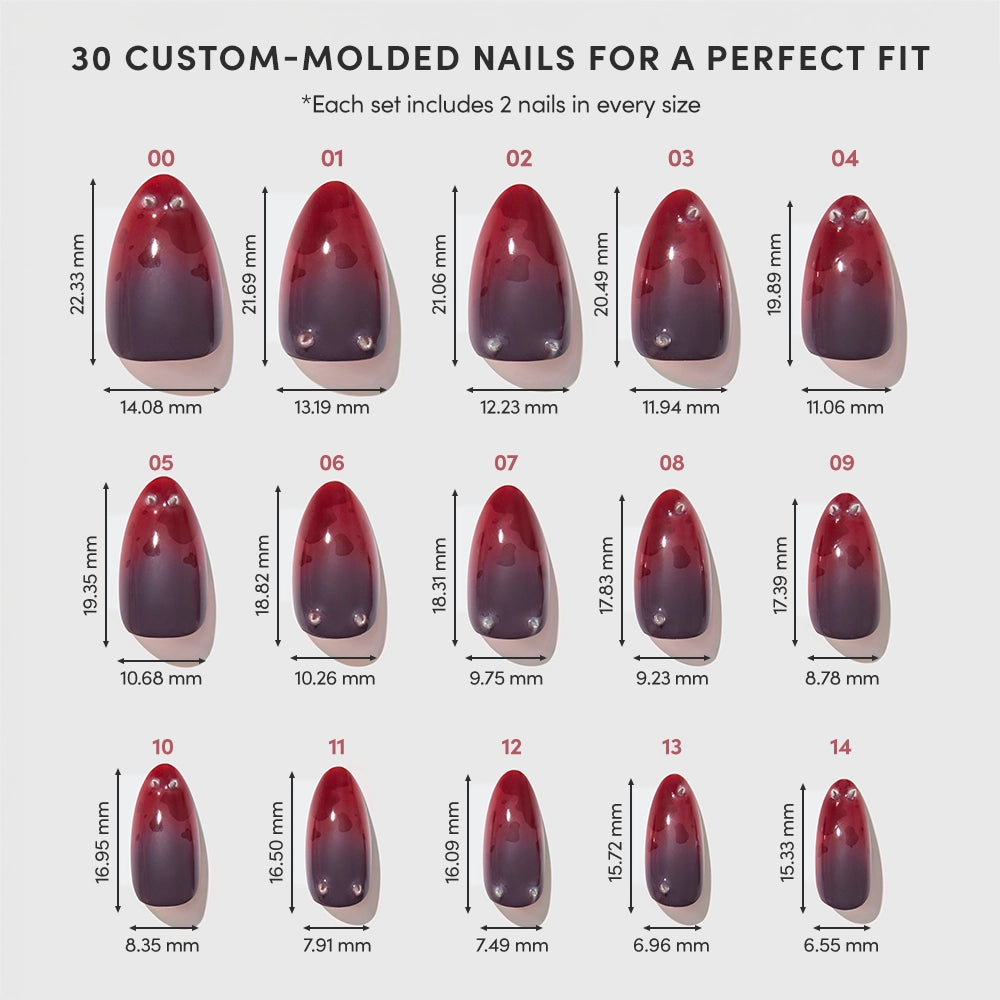 Fifteen pairs of Lil Devils custom-molded, red-to-black gradient press-on nails from glamnetic are arranged by size, each labeled with length and width measurements. Text reads 30 Lil Devils Custom-Molded Press-On Nails by glamnetic for a Perfect Fit. - Product image