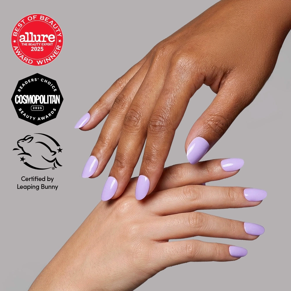 Short, round, lilac Glamnetic nail set shown alongside award badges from Allure and Cosmopolitan and a Leaping Bunny certification logo.