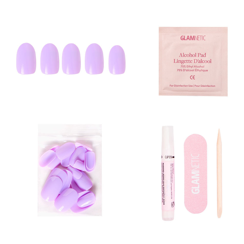 The glamnetic Lilac Nail Set includes purple press-on nails, an alcohol pad, extra nails, nail glue, a pink file, and a cuticle stick—all arranged on a white background. - Product image
