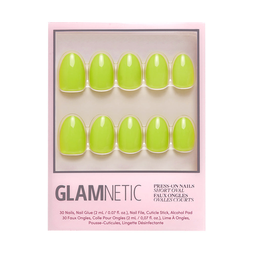 A package of glamnetic Lime Green short oval nails in a bold shade, displayed in two rows inside a pink and white box with branded text—stylish press-ons perfect for any occasion.