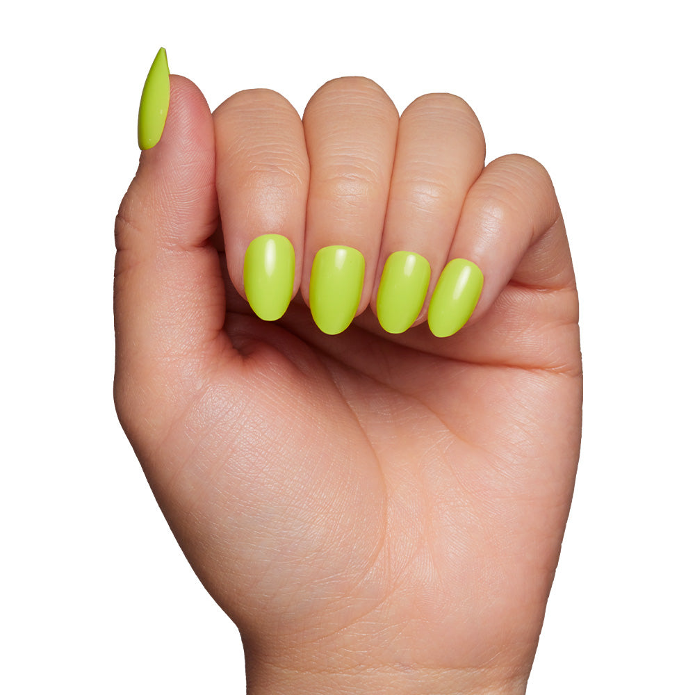 A close-up of a hand with well-manicured short oval nails painted in glamnetic’s Lime Green, shown against a plain white background. - Product image