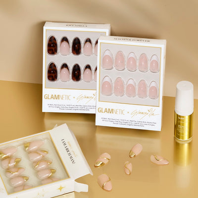 Glamnetic press-on nail sets with a glamzilla brush-on nail glue on a beige background