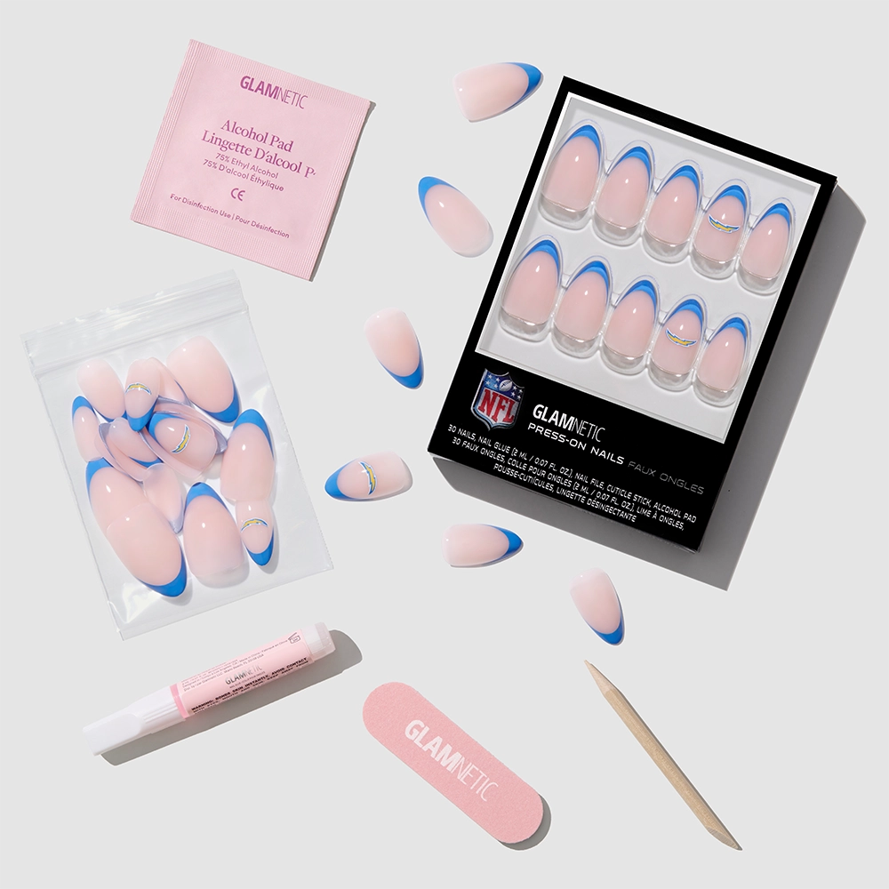 The glamnetic Los Angeles Chargers Press-On Nail Set features almond-shaped pink and blue French tips, extra nails, an alcohol pad, nail glue, nail file, and wooden cuticle stick—perfect for Chargers fans. Displayed on a light gray background. - Product image