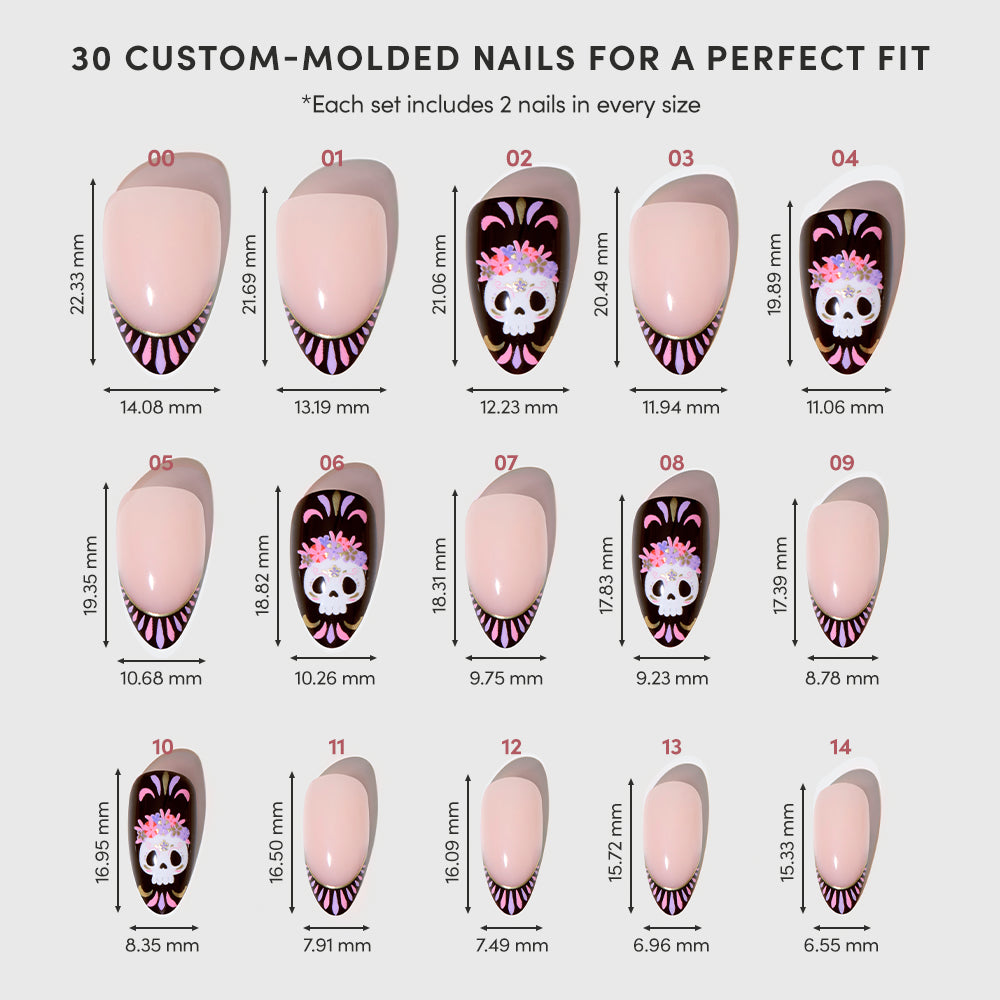 A chart displaying the glamnetic Mani De Los Muertos press-on nail set, which includes 15 custom-molded short almond nails (sizes 00–14). Each nail features a French tip design with alternating nude and black bases, adorned with Day of the Dead-inspired floral skull patterns. Dimensions for every size are included. - Product image