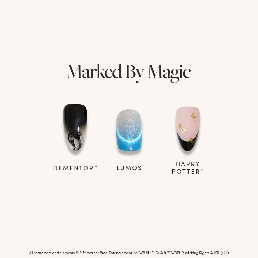 The “Marked By Magic” almond press-on nails by glamnetic feature glossy black and gray Dementor, shimmery blue Lumos, and pink magical symbol designs.