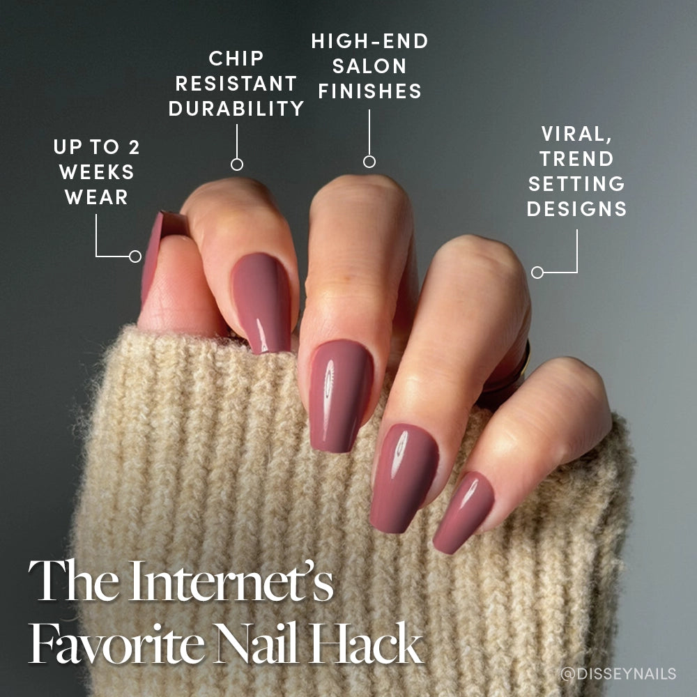 A hand with glamnetic’s Mauve Affair glossy, medium coffin fake nails is shown against a gray background, with text highlighting chip resistance, salon-quality finish, trendy mauve design, and up to 2 weeks of wear. - Product image