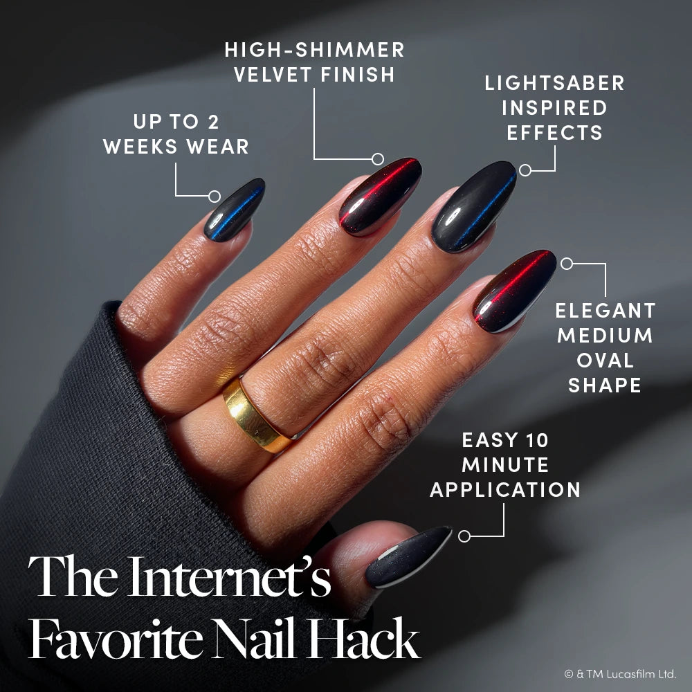 A hand with oval-shaped nails showcases the glamnetic “May The Force Be With You” press-on nails—featuring a black manicure topped with a high-shimmer velvet finish and striking red lightsaber-inspired streaks. This STAR WARS-inspired design is durable, easy to apply, and exudes an elegant flair. - Product image