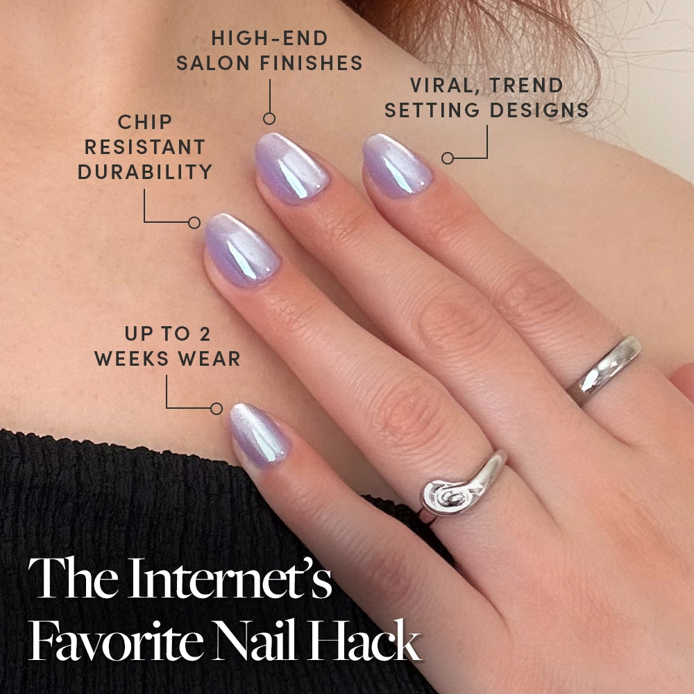 A hand with iridescent purple glamnetic Mermaids Tail press-on nails rests on a shoulder. Text highlights: high-end salon finish, viral designs, chip-resistant durability, up to 2 weeks wear. Caption: The Internet’s Favorite Nail Hack. - Product image