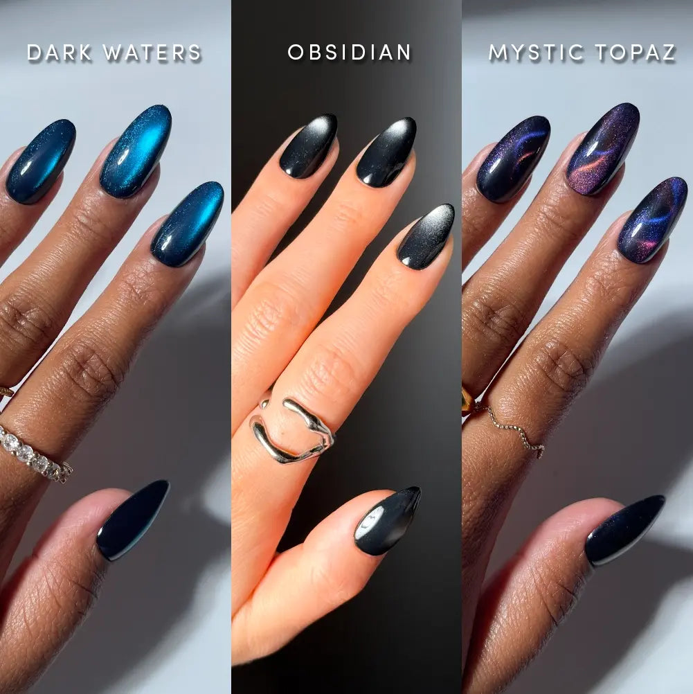 Three hands display manicures: blue shimmer (labeled Midnight Depths by glamnetic), black metallic with a velvet finish reminiscent of black aura nails, and purple-black with iridescent streaks. Each hand is adorned with rings, and every look is achieved effortlessly with our premium press-on nails. - Product image