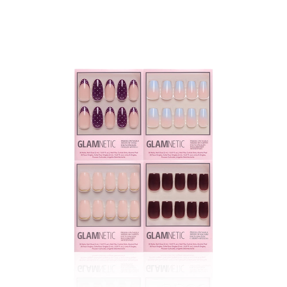 Four Glamnetic Mixed Mediums salon-quality nail sets in pink packaging are arranged in two rows on a white background. The set includes: medium-length purple nails with white dots, pale pink press-on nails, glossy nude nails, and dark burgundy nails. - Product image