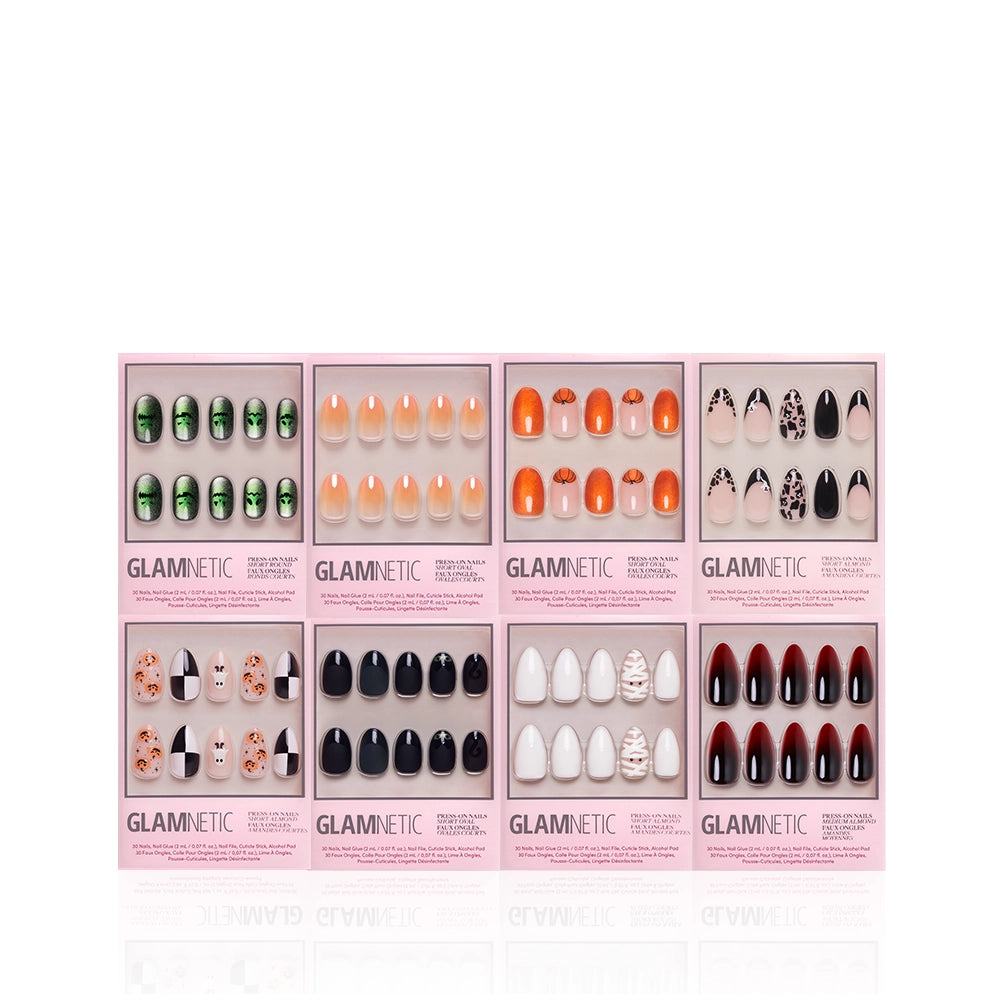 Eight sets of Glamnetic Monster Mash-Up limited-edition press-on nail sets in a variety of colors and patterns—including green, nude, orange, black, white, and animal print—are displayed in pink packaging against a white background. Perfect for creating a spooky nail bundle or experimenting with Halloween-ready nails. - Product image