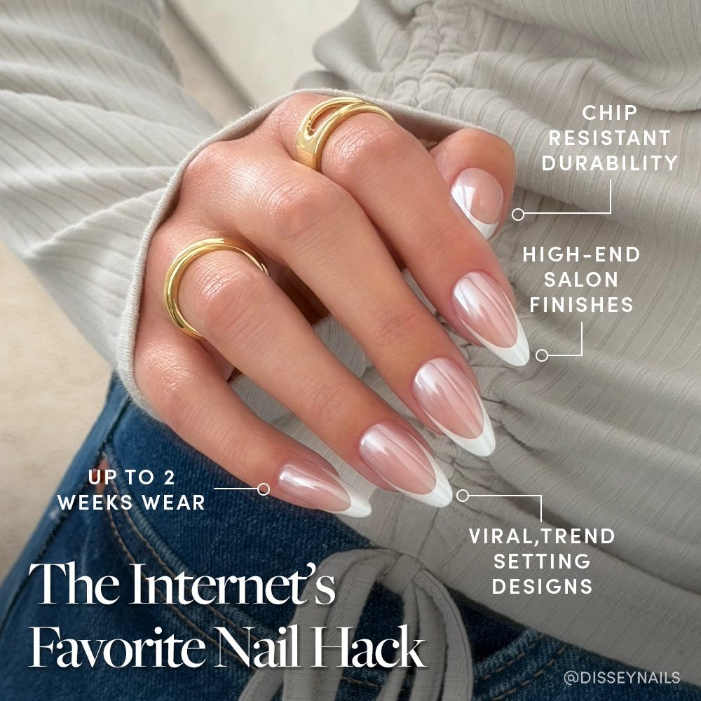 A hand with long, almond-shaped glamnetic Mother Pearl Press-On Nails in a French tip and gold rings is shown. Features: chip resistant, glossy glazed finish, up to 2 weeks wear, and trendy designs. The Internet’s Favorite Nail Hack appears below. - Product image