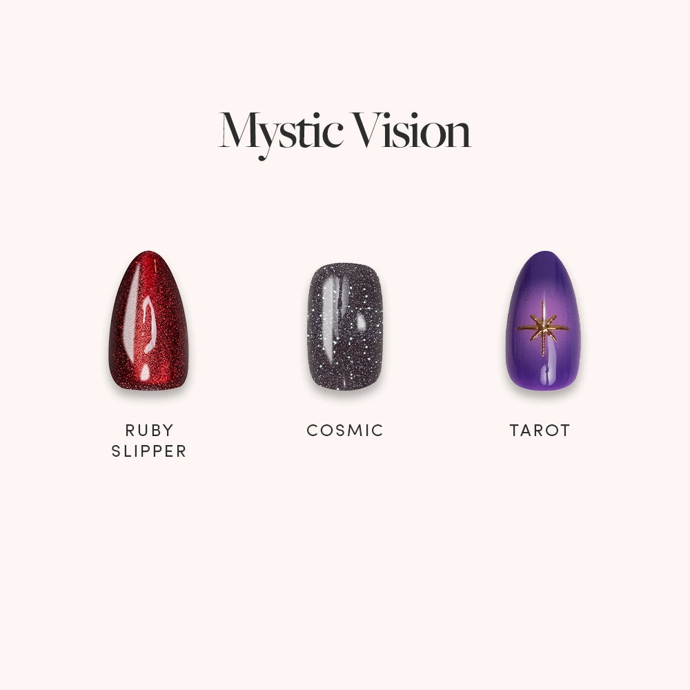 Three glamnetic press-on nails displayed: glittery red (Ruby Slipper), sparkly gray (Cosmic), and purple with gold stars (Tarot). Text above: Mystic Vision. All are vegan, cruelty-free for a chic look.