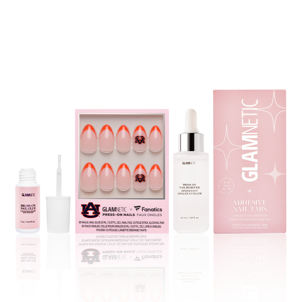 The Auburn Tigers Gameplan by glamnetic includes press-on nails with orange French tips and the Auburn University logo, plus adhesive tabs, glue, remover, and comes in chic white and pink packaging—perfect for game day style.