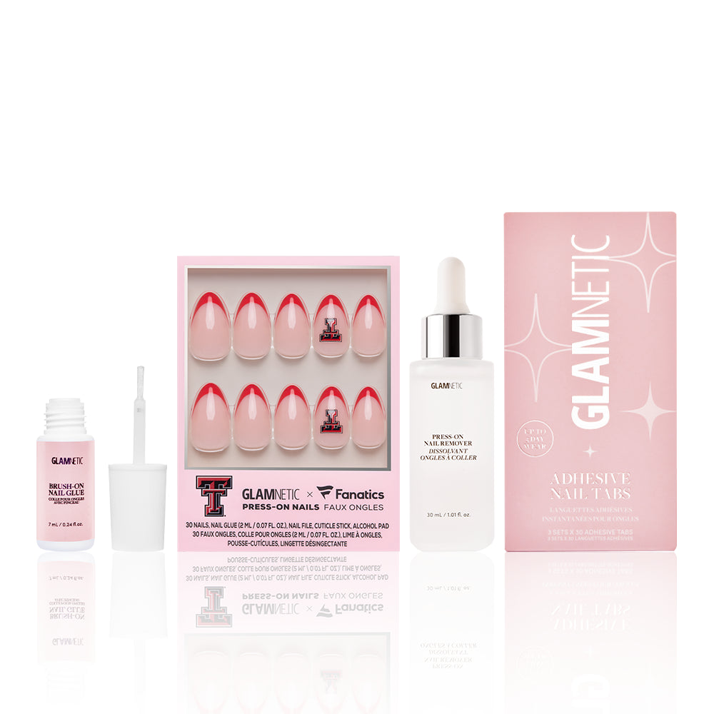 The Texas Tech Red Raiders Gameplan by glamnetic includes press-on nails in a pink box with scarlet tips, nail glue, a liquid dropper bottle, and GLAMNETIC Adhesive Nail Tabs—everything you need for the perfect game day manicure.