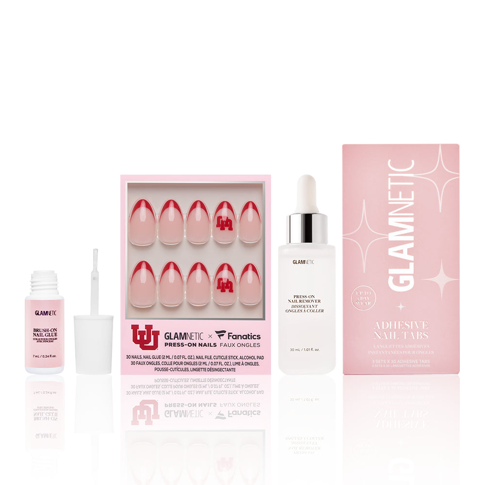 The Utah Utes Gameplan by glamnetic features pink-red French tip nails with the Utah Utes logo—perfect for game day. Set includes adhesive tabs, nail glue, and a liquid dropper bottle, all branded glamnetic and shown in white-background packaging.