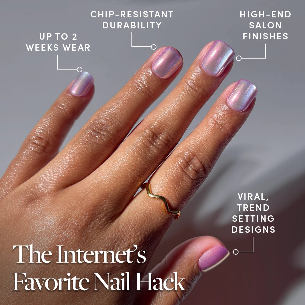A hand with super short, shiny, light pink Oyster Baby press-on nails by glamnetic is shown. Text highlights up to 2 weeks’ wear, chip-resistant durability, salon-quality finish, and viral trend-setting designs. - Product image