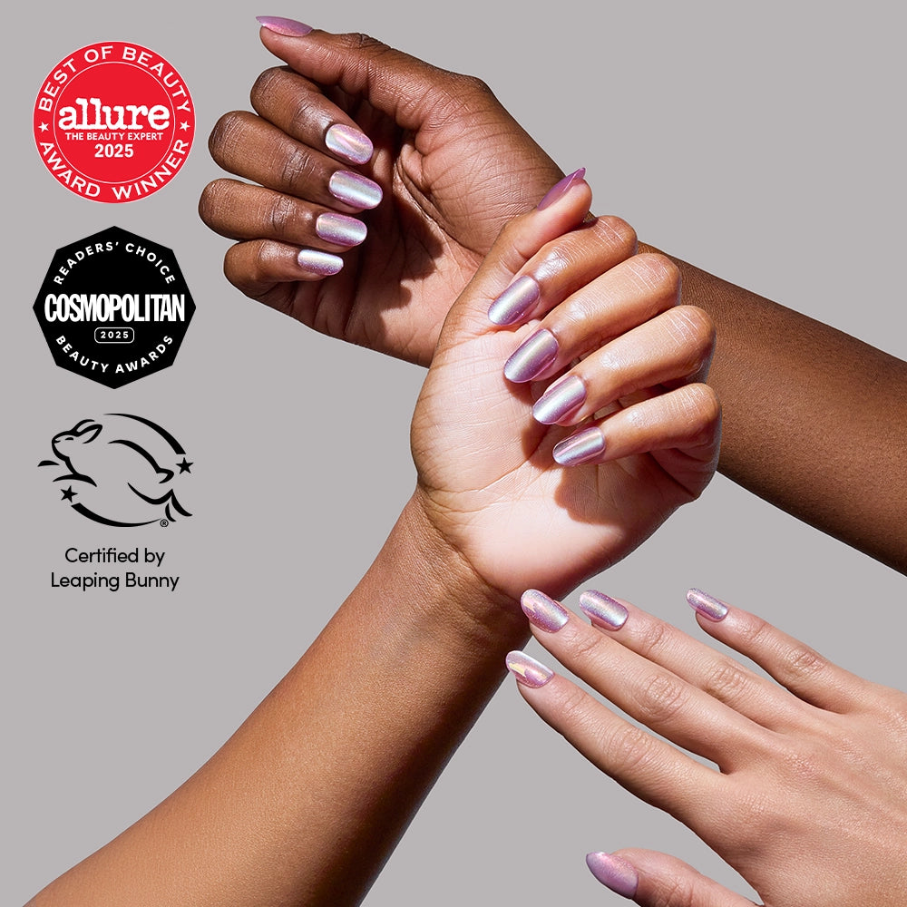 Three hands with different skin tones display shiny, pearlescent Oyster Glow nails by glamnetic. The image features Allure, Cosmopolitan, and Leaping Bunny award badges on a light gray background.