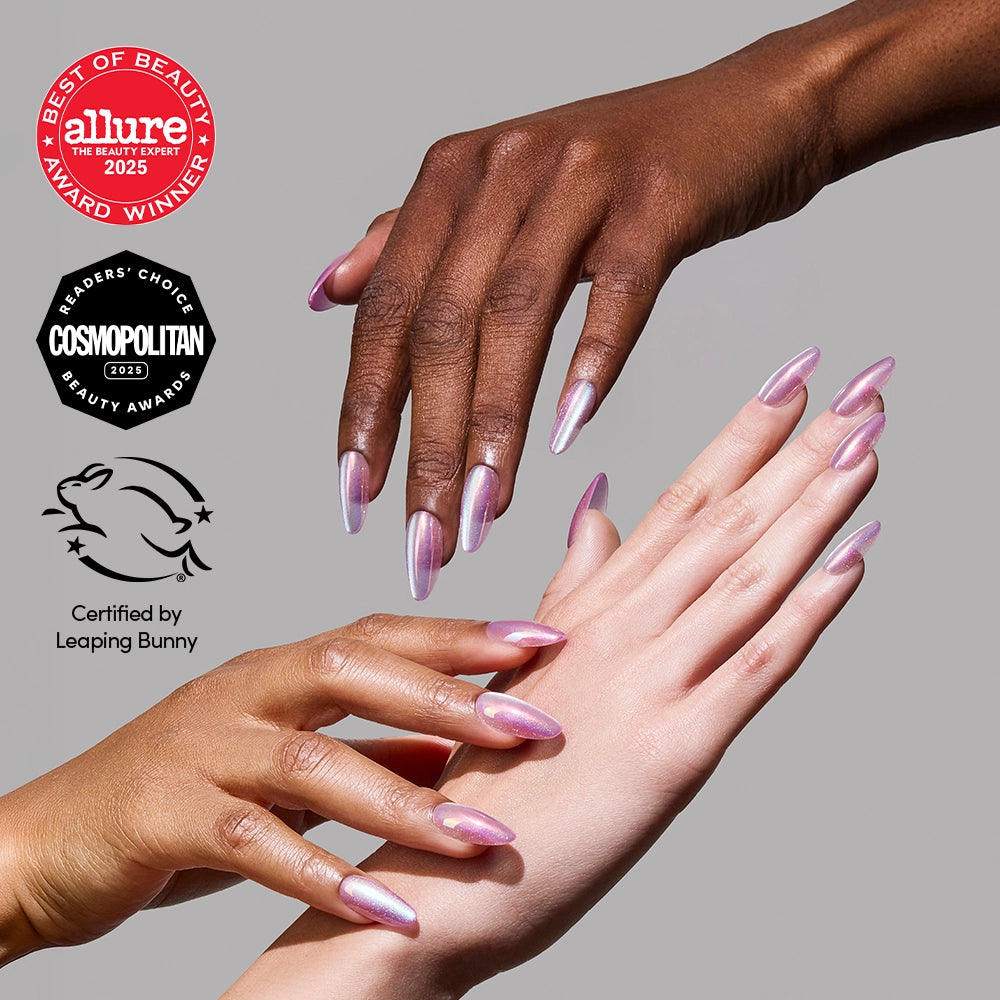 Three hands with long, iridescent pink pearlescent glamnetic Oyster Pearl press-on nails are shown against a neutral background, with Allure, Cosmopolitan, and Leaping Bunny award badges displayed on the left.