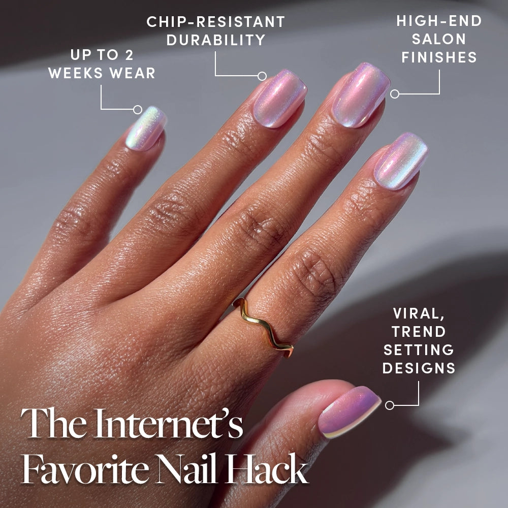 A hand displays glamnetic Oyster Shell pearlescent iridescent pink press-on gel nails. Text notes up to 2 weeks wear, chip-resistant durability, viral designs, and salon finishes. A gold ring decorates one finger. - Product image