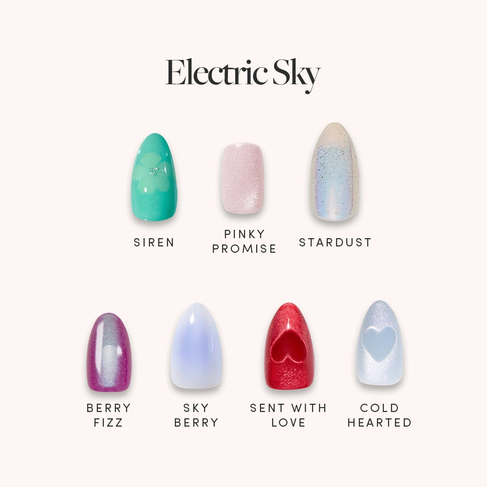 Seven salon-quality glamnetic artificial nails from the Electric Sky set are shown in two rows, each with a unique color or design like green, pink, blue, purple, a red heart accent, and shimmering details.