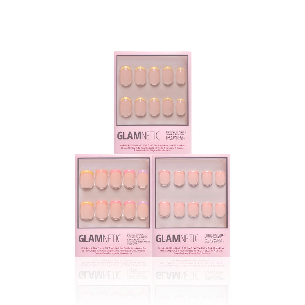 Three boxes of glamnetic Pardon My Pastels press-on nails are displayed against a white background. The nails showcase soft pink pastel shades with yellow and white French tips, each set neatly arranged in its packaging. - Product image