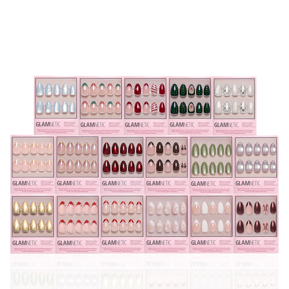 Fifteen boxes of glamnetic Park Avenue Almonds press-on nails, featuring various colors and designs from the Glam In The City collection, are arranged in three rows against a white background. Each bundle displays ten short almond press-on nails in a see-through window. - Product image