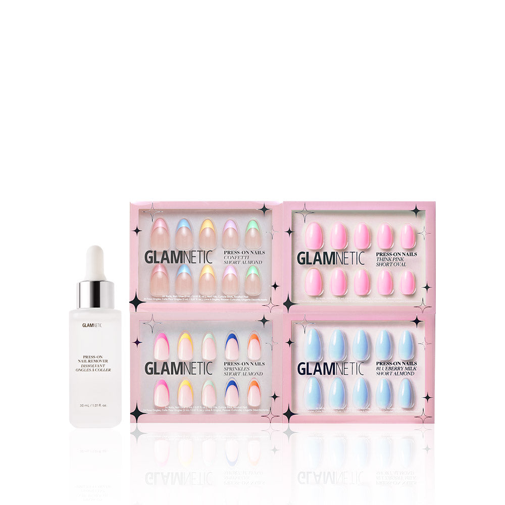 A bottle of Glamnetic 2-in-1 Cuticle Oil & Nail Serum sits beside four boxes of Glamnetic press-on nails, including the playful Pastel Princess set. Each box offers neatly arranged nails, perfect for an easy at-home manicure. - Product image