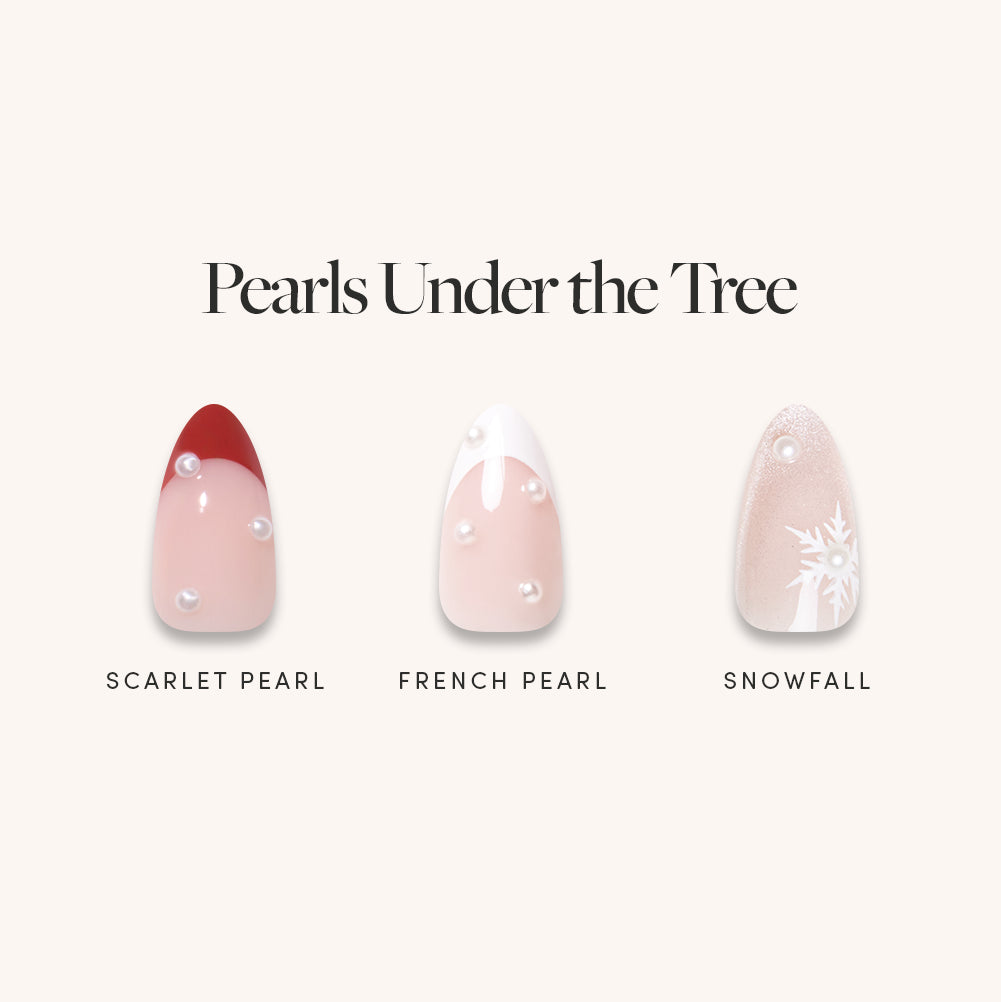 Glamnetic Pearls Under the Tree short almond press-on nails featuring a red tip with pearls, a white French tip with pearls, and a glittery design with a white snowflake and a single 3D pearl accent.