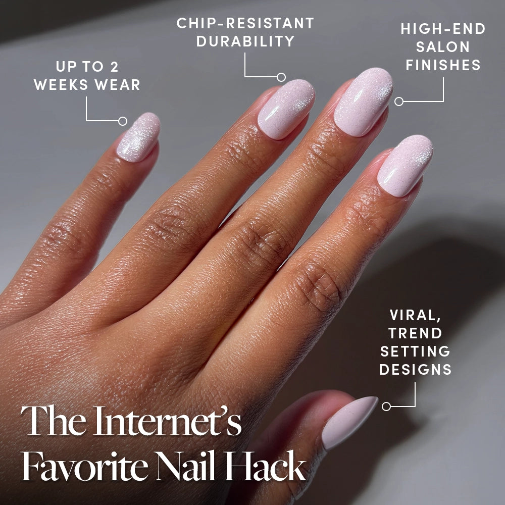 A hand shows glossy, light pink manicured nails. Text highlights glamnetic’s Pink Whisper short round press-ons: up to 2 weeks wear, chip-resistant, salon-quality finish, and trending designs. The Internet’s Favorite Nail Hack. - Product image