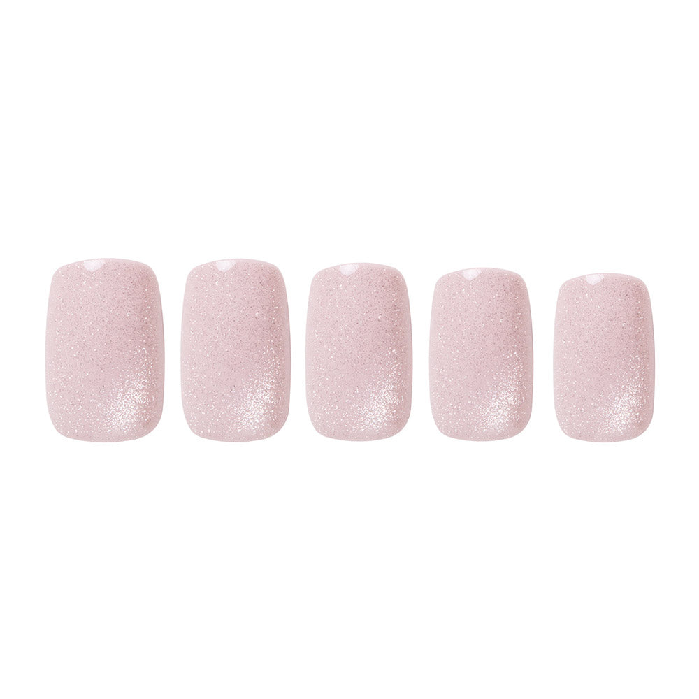 Glamnetic’s Pinky Promise: five reusable nails with a soft pink blush velvet finish and subtle glitter accents, arranged in a row on a white background. - Product image