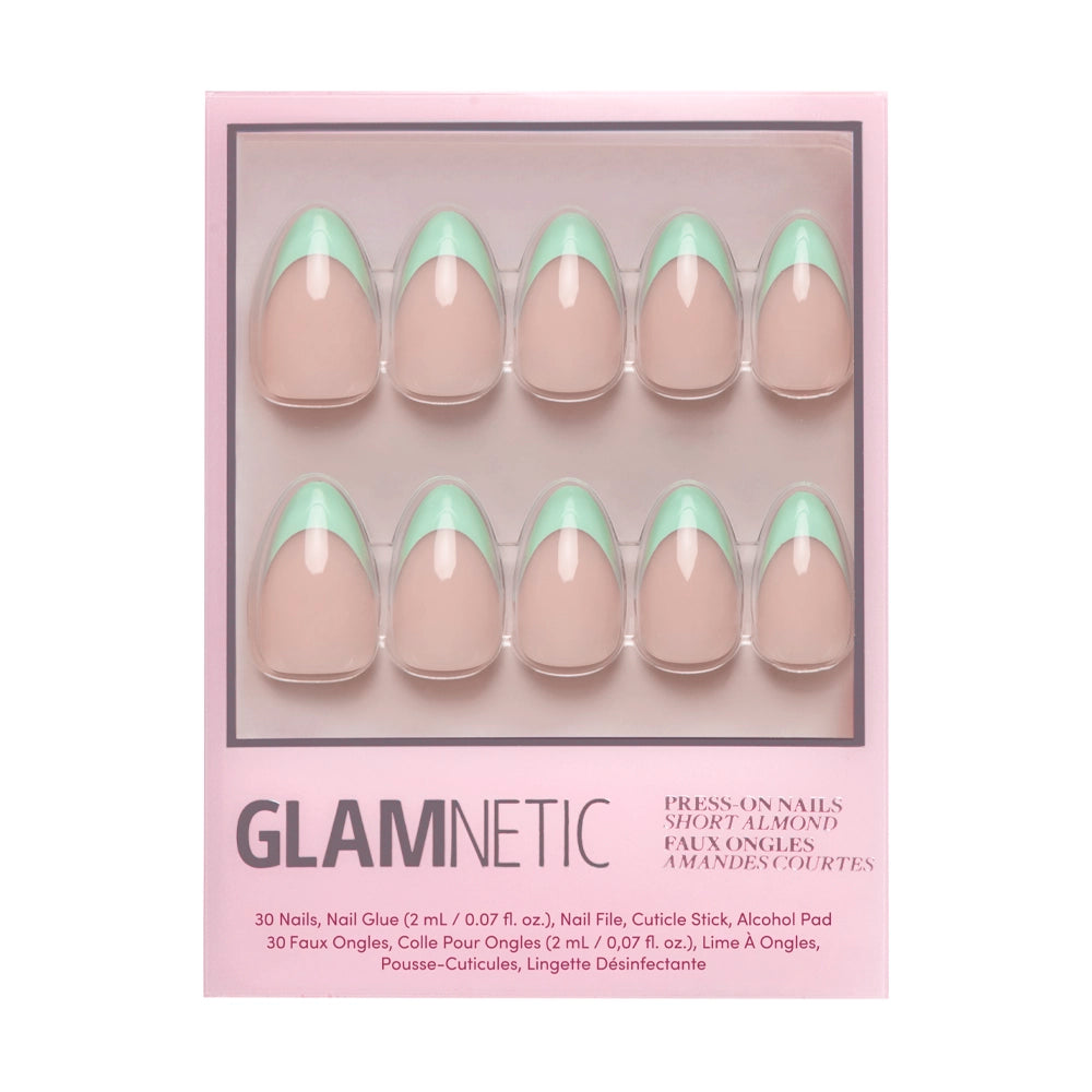 The glamnetic Pistachio Crème Press-On Nail Set includes 10 short almond nails with a nude base and mint green French tips, plus nail glue and manicure accessories in a pink box.