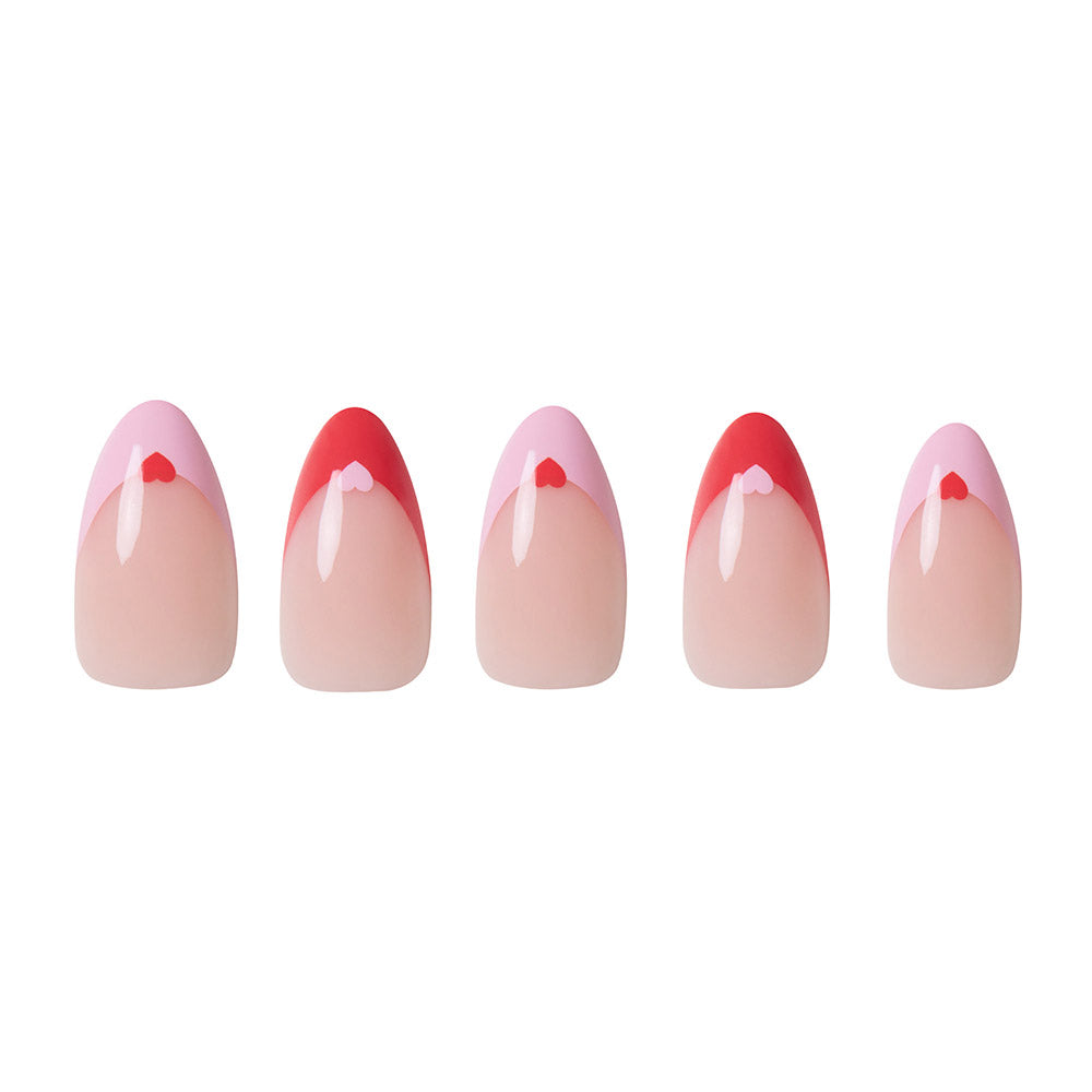 Five Pure Hearted artificial almond nails from glamnetic are arranged in a row, each with a nude base and pink and red French tips accented by hearts. Perfect for Valentine’s Day, the display is set against a white background. - Product image
