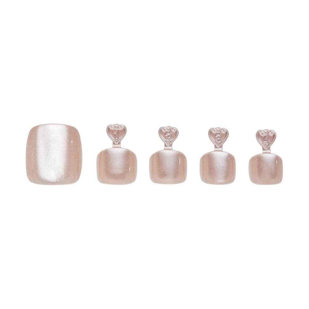 Sparkly rose nude press-on toenails in five sizes, each with heart-shaped tabs for application. - Product image