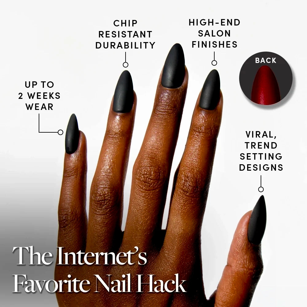 A hand with long Black Matte Almond Press-On Nails from glamnetic’s Red Bottom set is shown, featuring a striking red backing, chip-resistant durability, salon-quality finish, and up to 2 weeks wear. - Product image