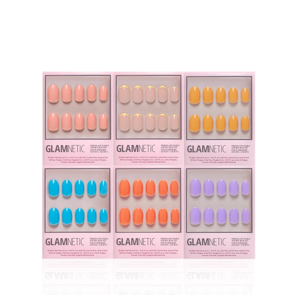 Six boxes of the glamnetic Round Highlighter Set are neatly arranged in two rows against a white background, showcasing salon-quality press-on nails in assorted colors for an effortless at-home manicure. - Product image