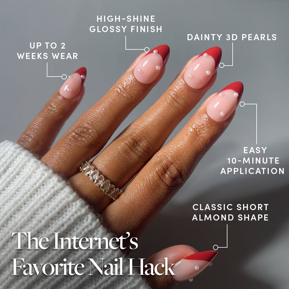 Glamnetic Scarlet Pearl press-on nails in a short almond shape, featuring red French tips with small pearl accents, a high-shine finish, 10-minute application, and two-week wear. - Product image
