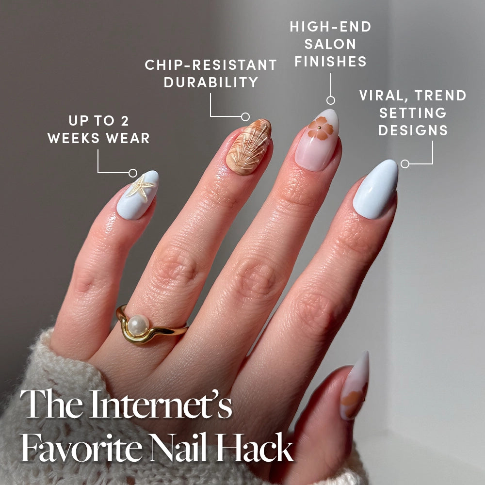 A hand with long, almond-shaped glamnetic Sea Star nails shows off viral, trendsetting 3D shell accents and floral nail art. Enjoy up to 2 weeks’ chip-resistant wear and high-end finishes for a standout look. - Product image