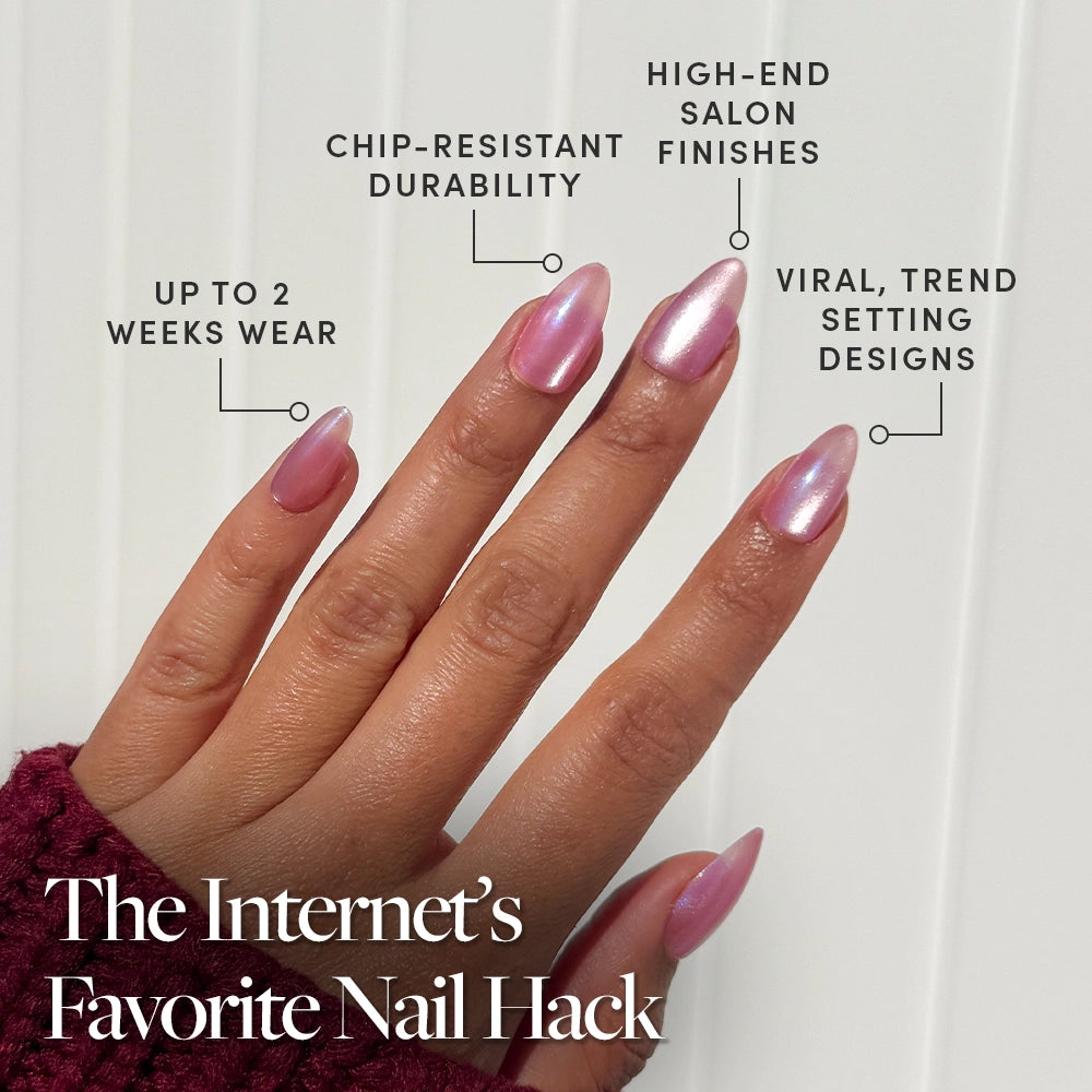 A hand with long, shiny, pink nails is shown. Labels note: up to 2 weeks wear, chip-resistant durability, shimmering velvet finish, and viral designs. Text reads: Seaspell Press-On Nail Set by glamnetic—The Internets Favorite Nail Hack. - Product image